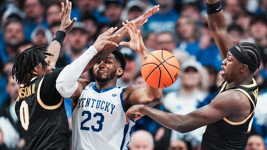 Kentucky Wildcats forward Mouhamed Dioubate (23) gets double-teamed by Missouri Tigers guard Anthony Robinson II (0) at left