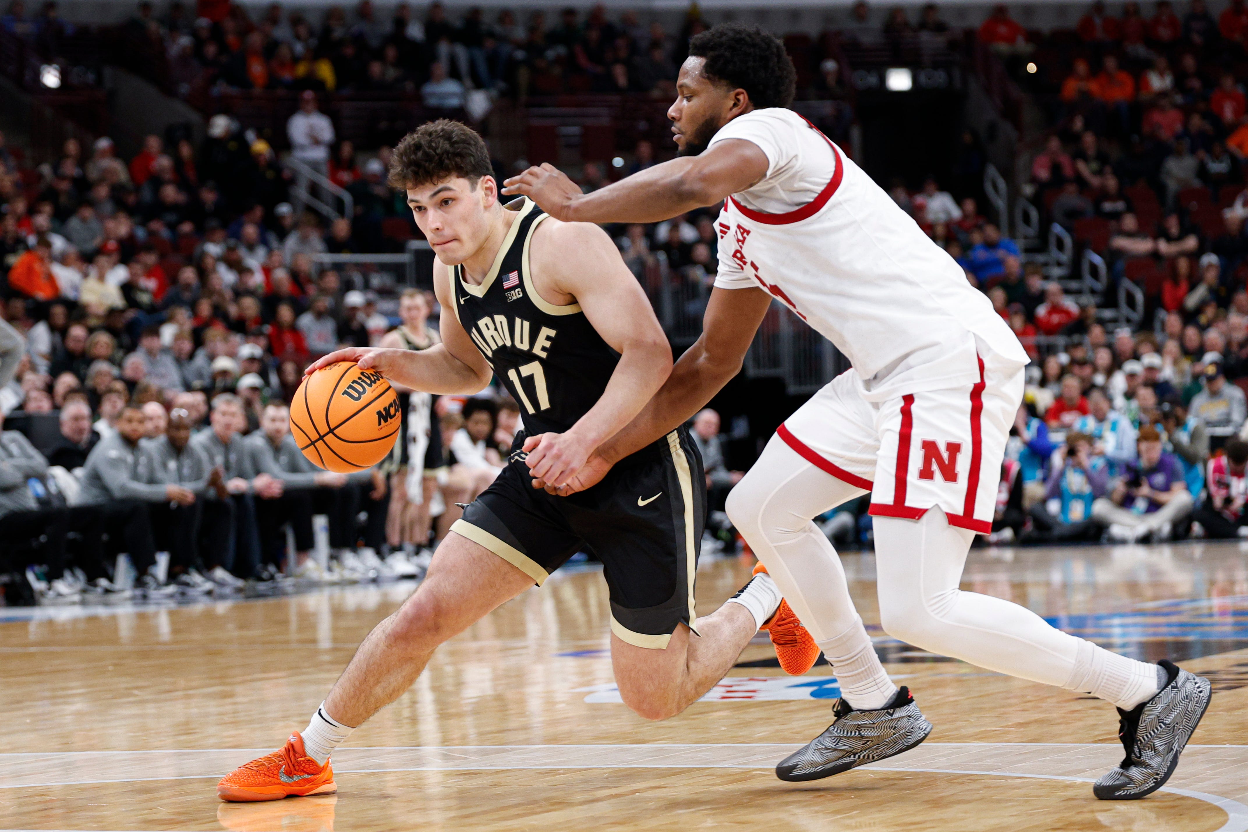 Mar 13, 2026; Chicago, IL, USA; Purdue Boilermakers guard Omer Mayer (17) drives to the basket against Nebraska Cornhuskers forward Jared Garcia (15) during the first half at United Center.
