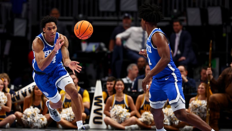 BYU guard Robert Wright III (1) passes the ball to forward Dominique Diomande during the Big 12 tournament at the T-Mobile Center in Kansas City, Missouri, on Wednesday, March 11, 2026.