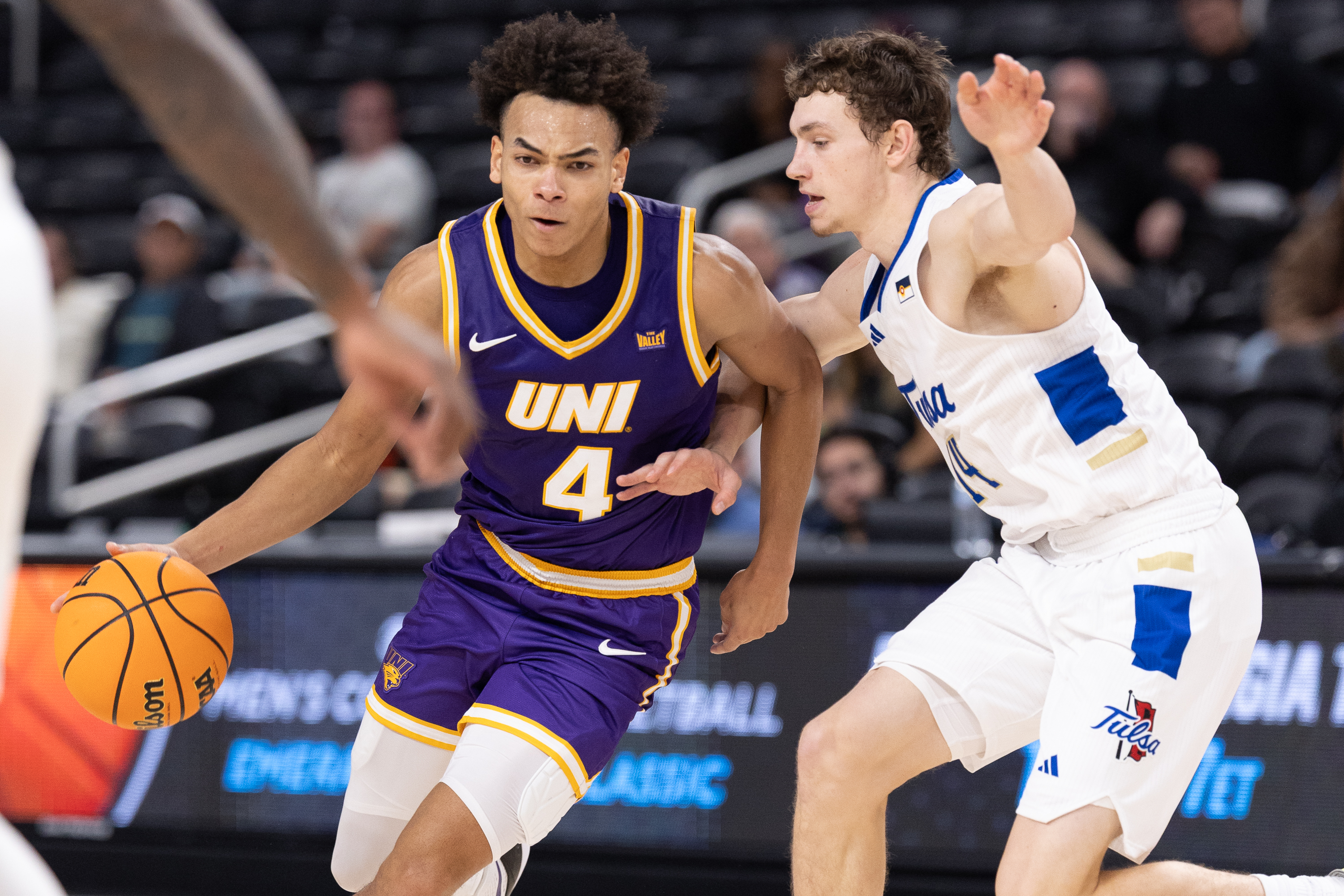 PALM DESERT, CA - NOVEMBER 26: UNI Panthers guard Trey Campbell #4 drives the ball during the Acrisure Series men's college basketball tournament game between the UNI Panthers and Tulsa Golden Hurricane on November 26, 2025, at the Acrisure Arena in Palm Desert, CA. (Photo by Greg Fiore/Icon Sportswire via Getty Images)