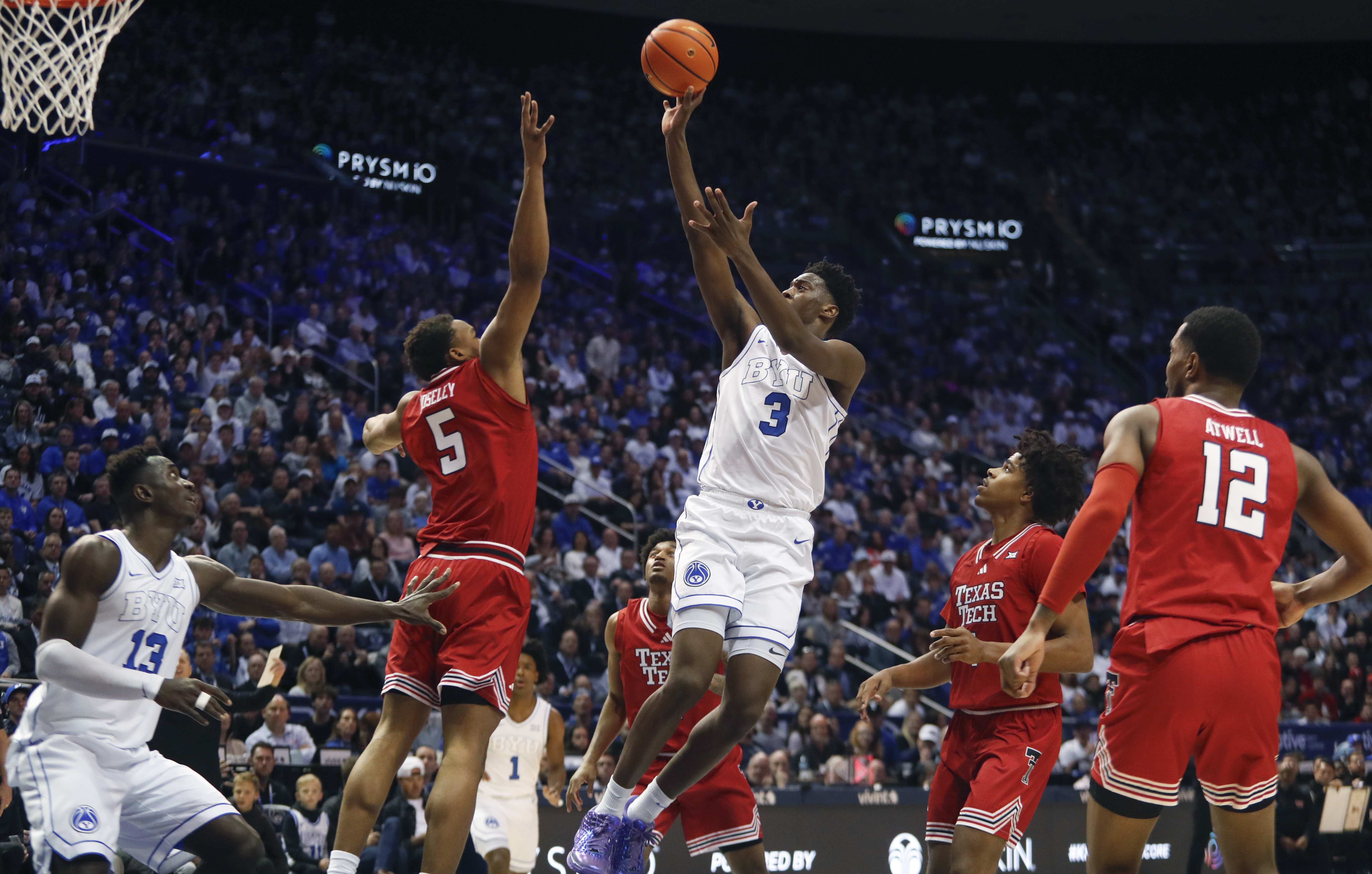 PROVO, UT - MARCH 7: AJ Dybantsa #3 of the Brigham Young Cougars shoots against Josiah Moseley #5, Christian Anderson #4, and Donovan Atwell #12 of the Texas Tech Red Raiders during the second half of their game at the Marriott Center on March 7, 2026 in Provo, Utah. (Photo by Chris Gardner/Getty Images)