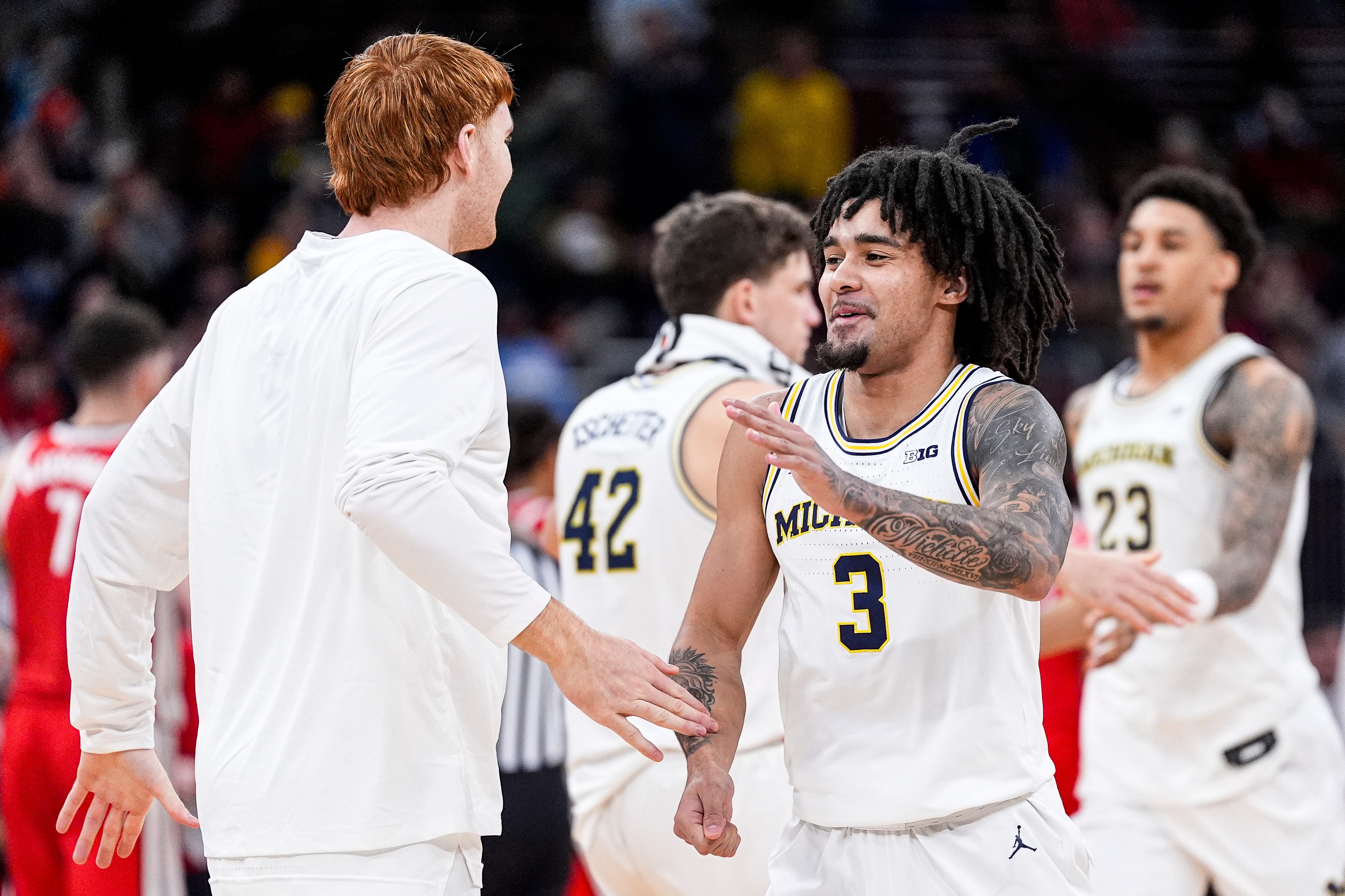 Michigan guard Elliot Cadeau (3) celebrates a play against Ohio State during the first half of Big Ten tournament quarterfinal at United Center in Chicago on Friday, March 13, 2026.