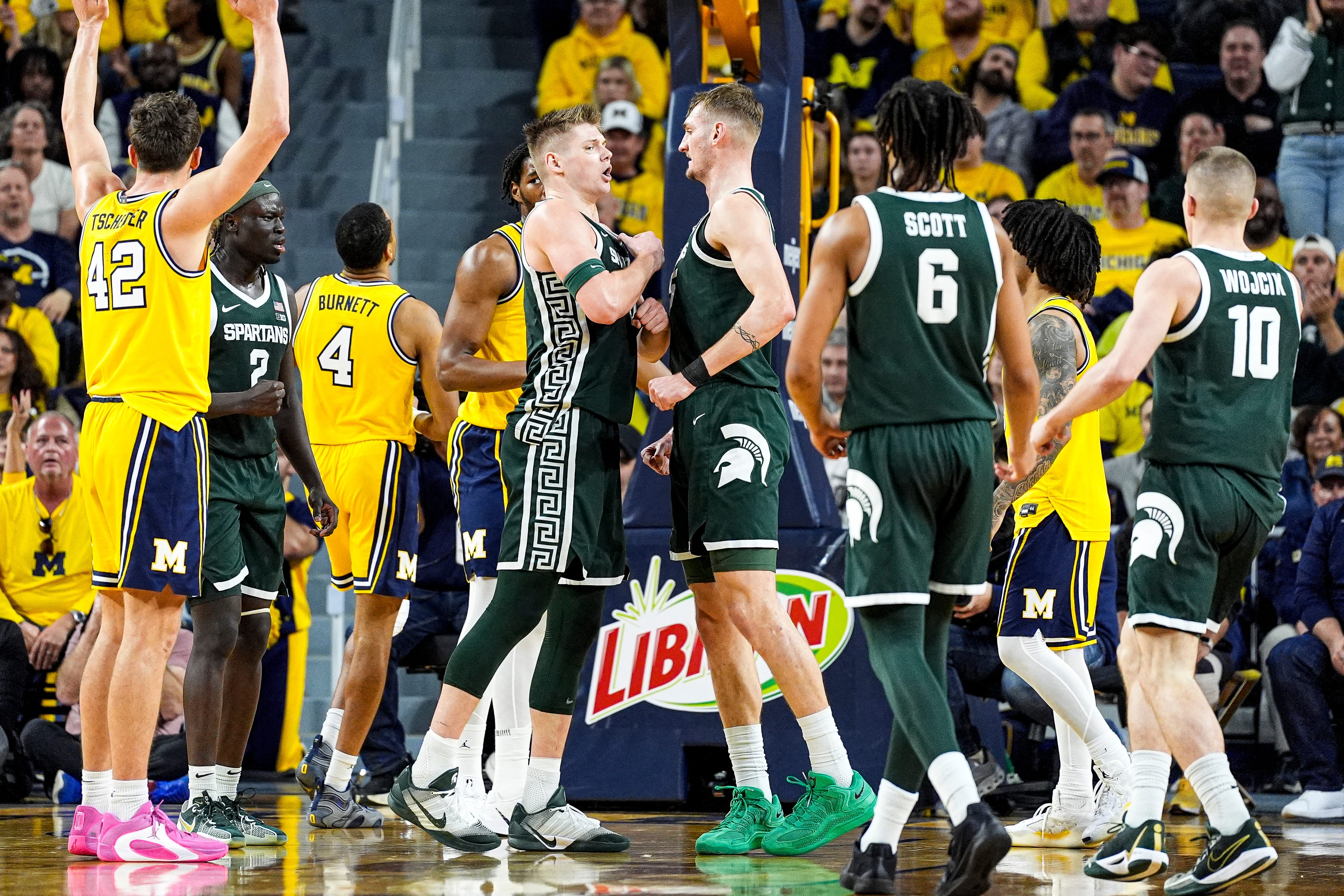 Michigan State forward Jaxon Kohler (0) celebrates a play against Michigan with center Carson Cooper (15) during the first half at Crisler Center in Ann Arbor on Sunday, March 8, 2026.