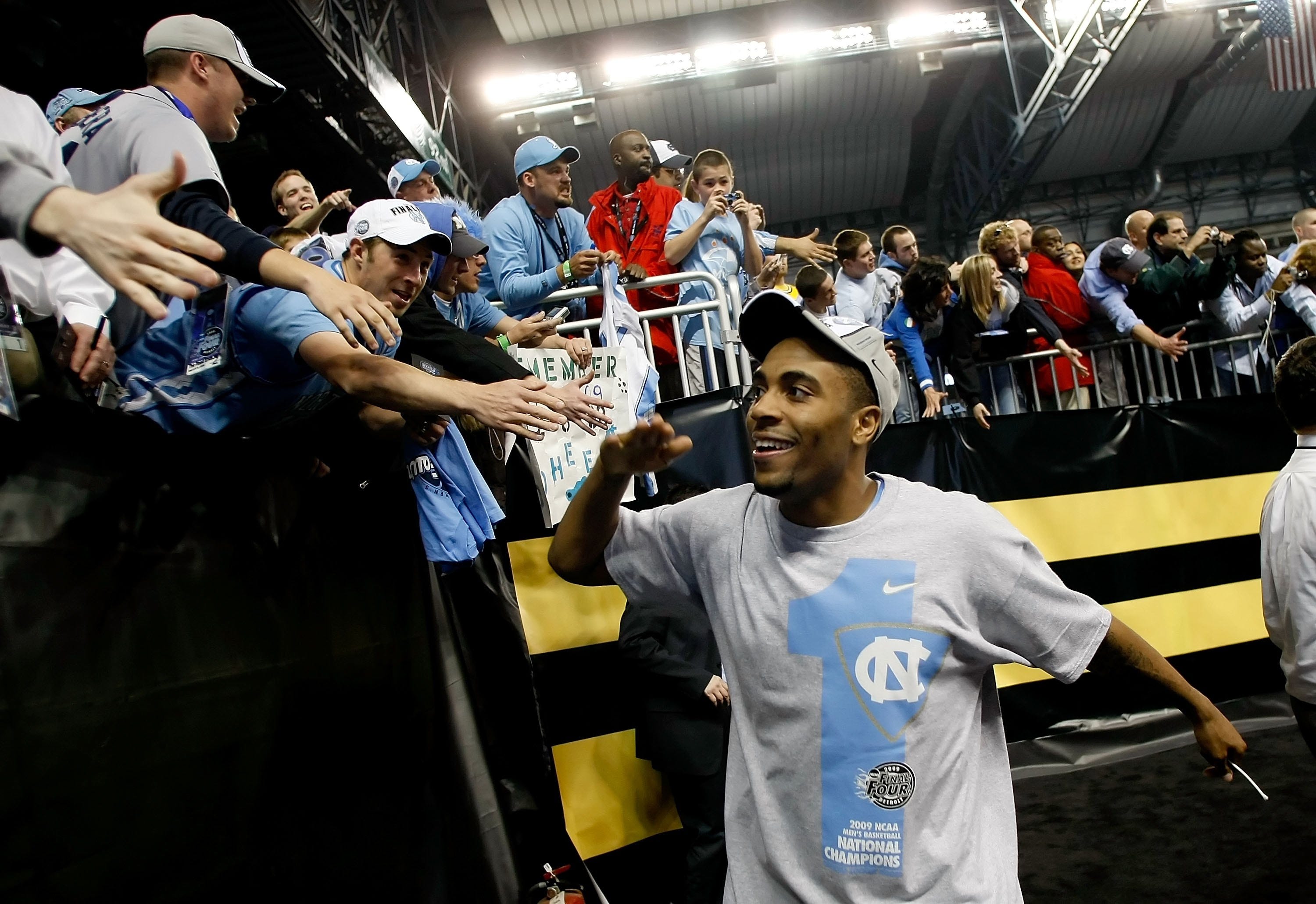 Wayne Ellington of the North Carolina Tar Heels celebrates with fans as he run off the court after the Tar Heels 89-72 win against the Michigan State Spartans during the 2009 NCAA Division I Men's Basketball National Championship game.