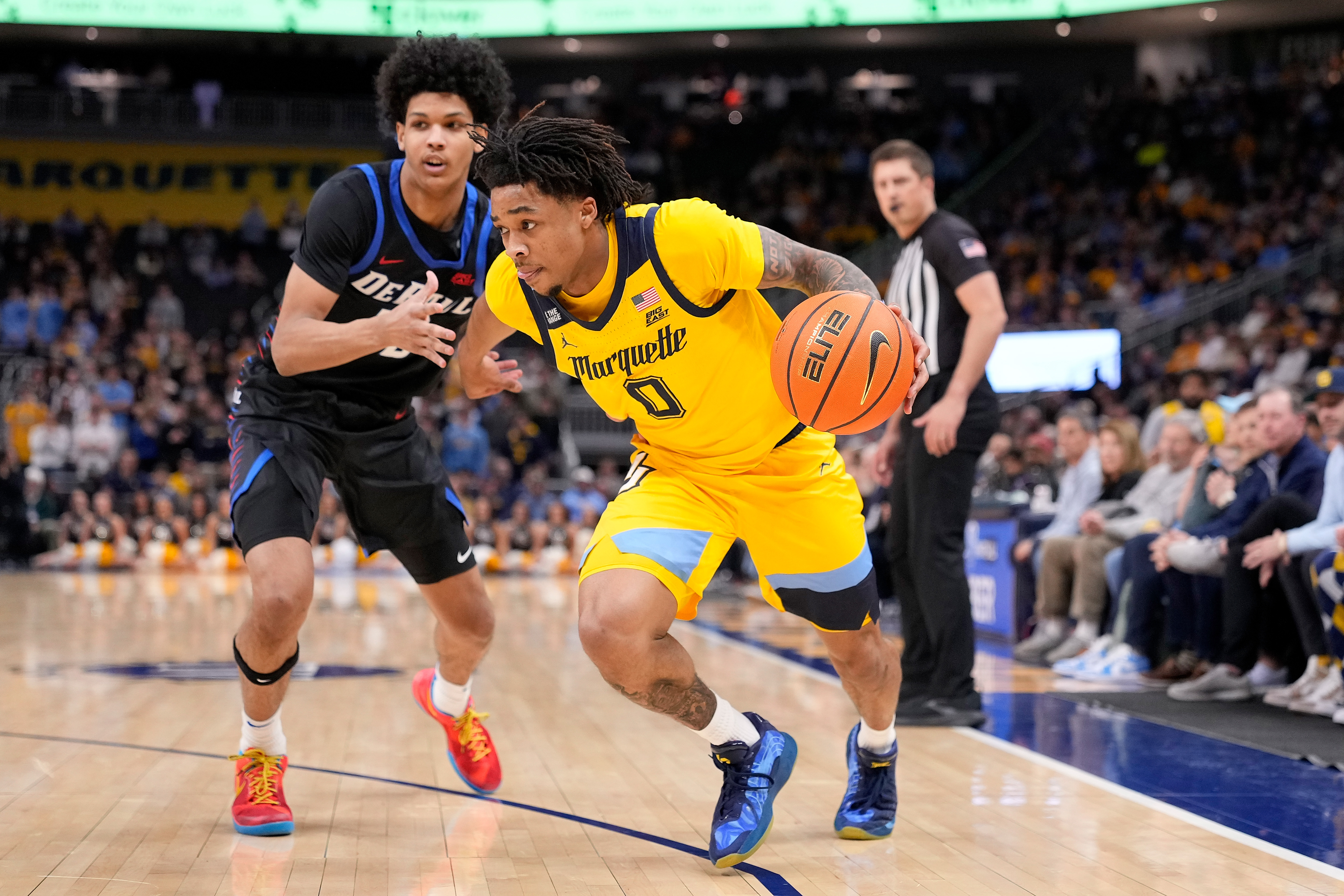 &nbsp;MILWAUKEE, WISCONSIN - MARCH 01: Nigel James Jr. #0 of the Marquette Golden Eagles drives to the basket past Kruz McClure #22 of the DePaul Blue Demons during the first half at Fiserv Forum on March 01, 2026 in Milwaukee, Wisconsin.