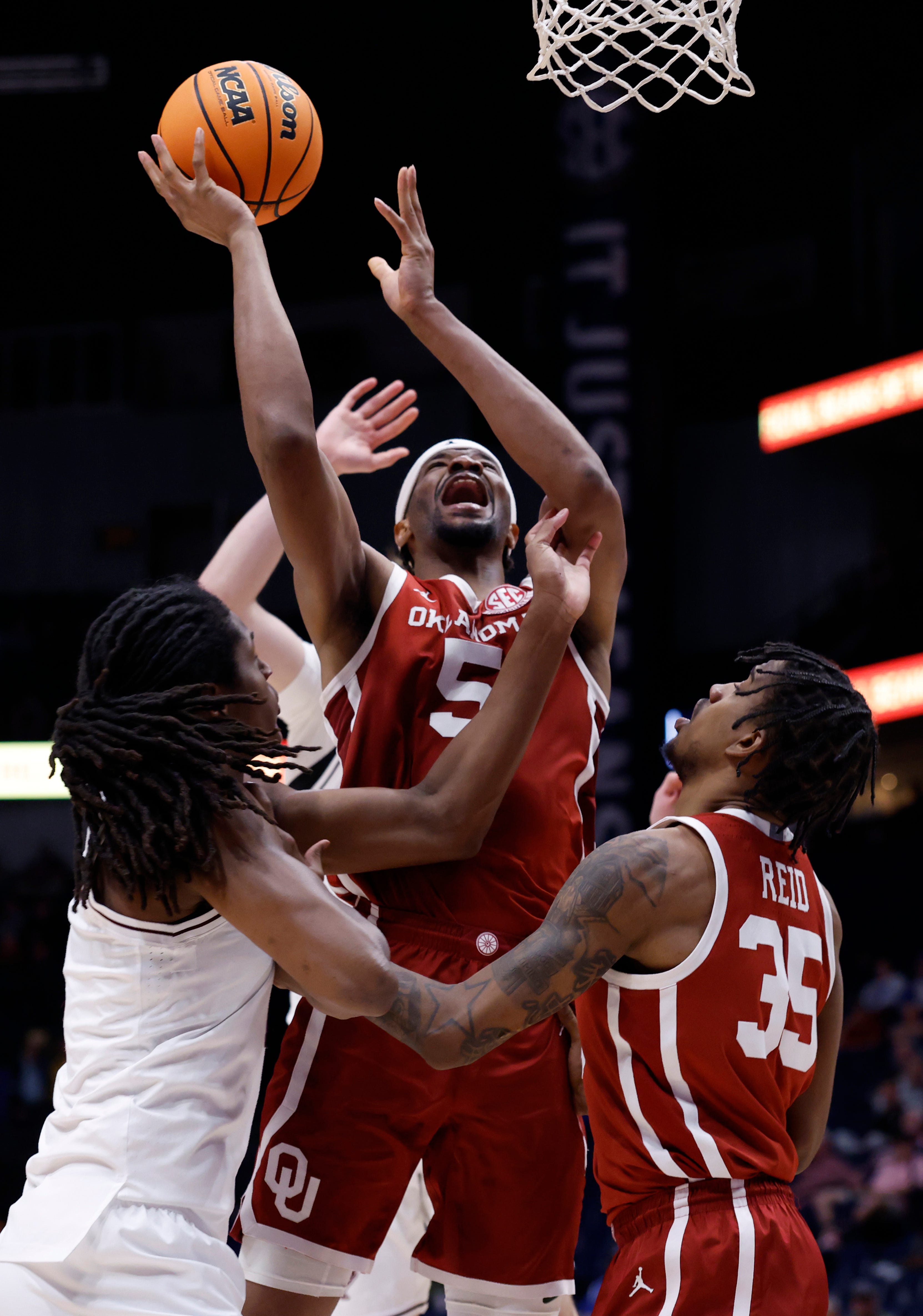 NASHVILLE, TENNESSEE - MARCH 12: Mohamed Wague #5 of the Oklahoma Sooners shoots the ball against Jamie Vinson #4 of the Texas A&M Aggies during the second half in the second round of the 2026 SEC Men's Basketball Tournament at Bridgestone Arena on March 12, 2026 in Nashville, Tennessee. (Photo by Johnnie Izquierdo/Getty Images)