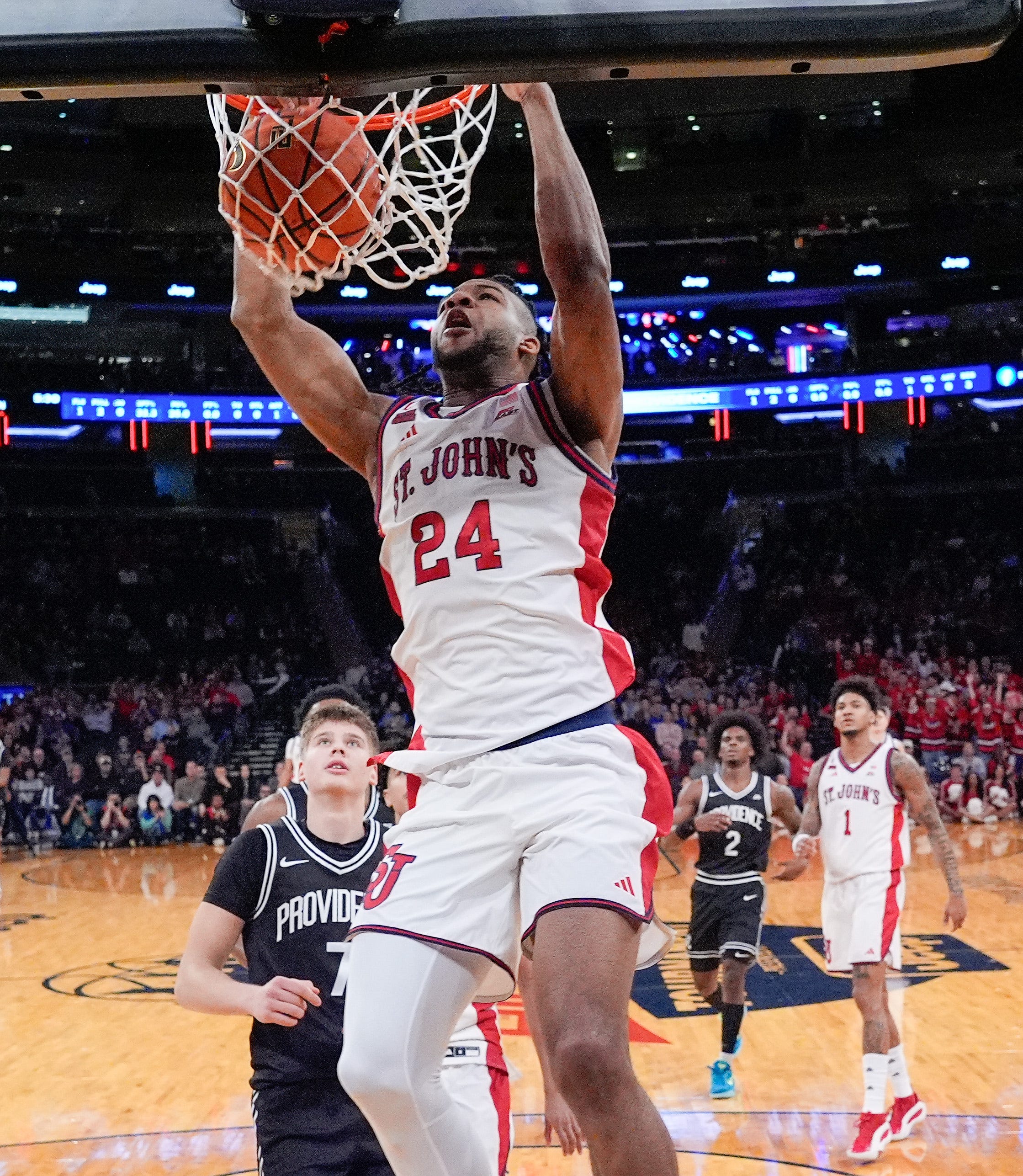 St. John's forward Zuby Ejiofor dunks over the Providence defense during the first half at Madison Square Garden on March 12.
