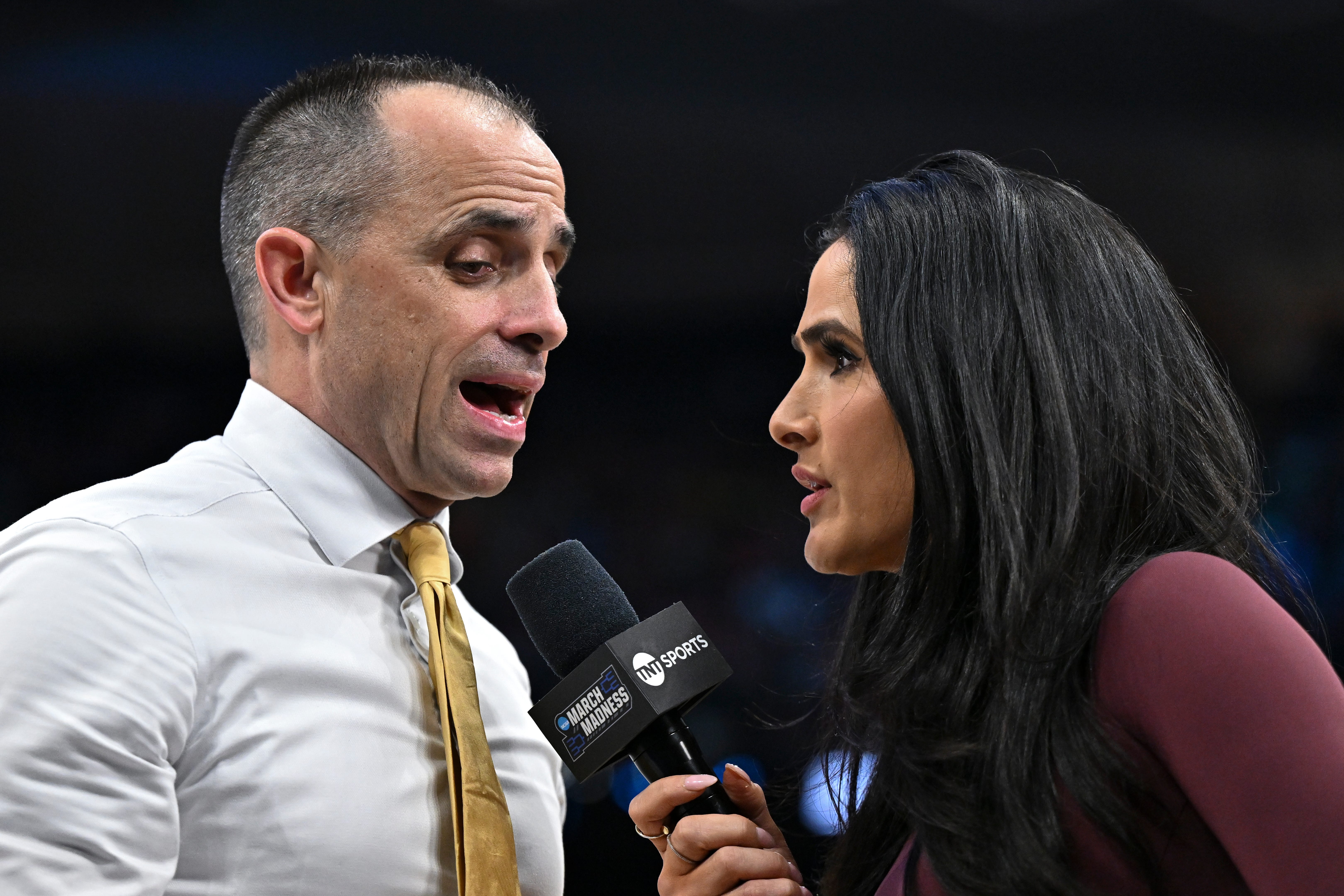Mar 26, 2026; Houston, TX, USA; TNT Sports reporter Lauren Shehadi speak with Iowa Hawkeyes head coach Ben McCollum during a time-out in the first half of a Sweet Sixteen game of the South Regional of the men's 2026 NCAA Tournament at Toyota Center. Mandatory Credit: Maria Lysaker-Imagn Images