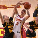USC Trojans guard Jazzy Davidson (9) shoots a basket as she is defended by Iowa Hawkeyes guard Teagan Mallegni (55) and guard Ava Heiden (5) in the first half at Galen Center on Jan 29, 2026.