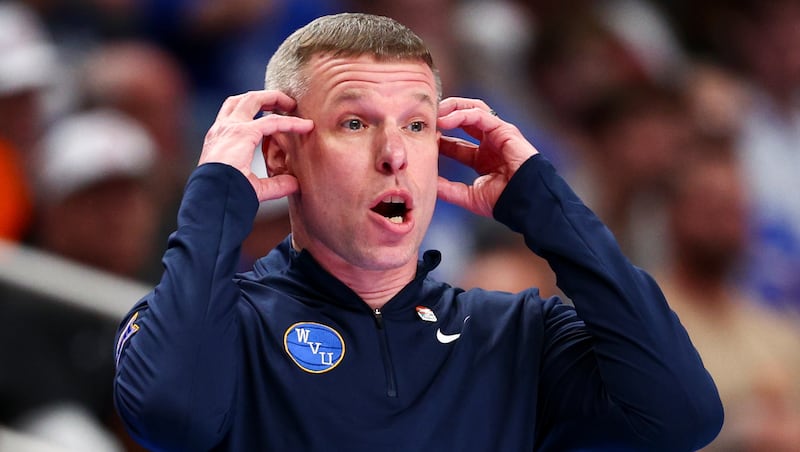 West Virginia Mountaineers head coach Ross Hodge calls out to his players during the first half of the game against BYU in the second round of the 2026 Phillips 66 Big 12 Men's Basketball Tournament at the T-Mobile Center in Kansas City, Missouri, on Wednesday, March 11, 2026.