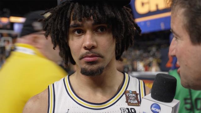 Andy Katz talks with Elliot Cadeau after Michigan's National Championship Win