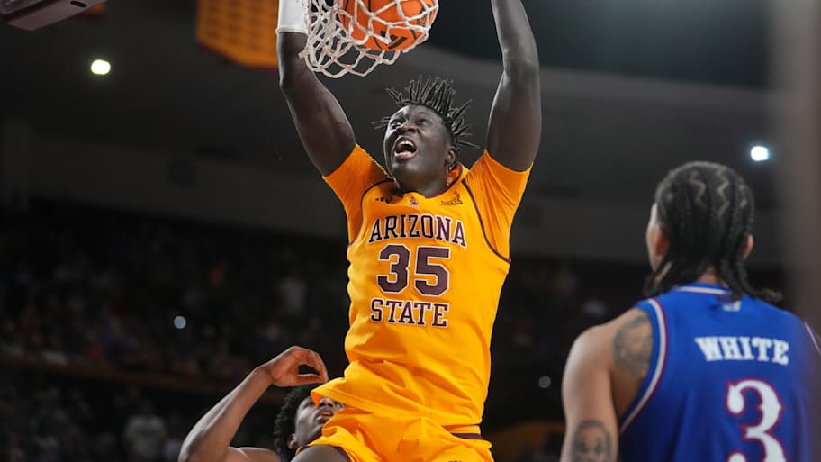 ASU Sun Devils center Massamba Diop (35) dunks the ball against the Kansas Jayhawks at Desert Financial Arena in Tempe