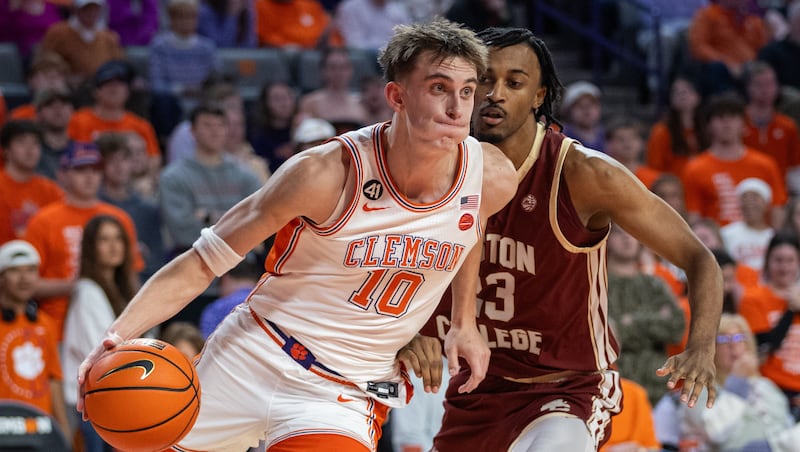 Clemson forward Jake Wahlin (10) drives past Boston College guard Aidan Shaw (23) during the second half of an NCAA college basketball game Tuesday, Jan. 13, 2026, in Clemson, S.C.