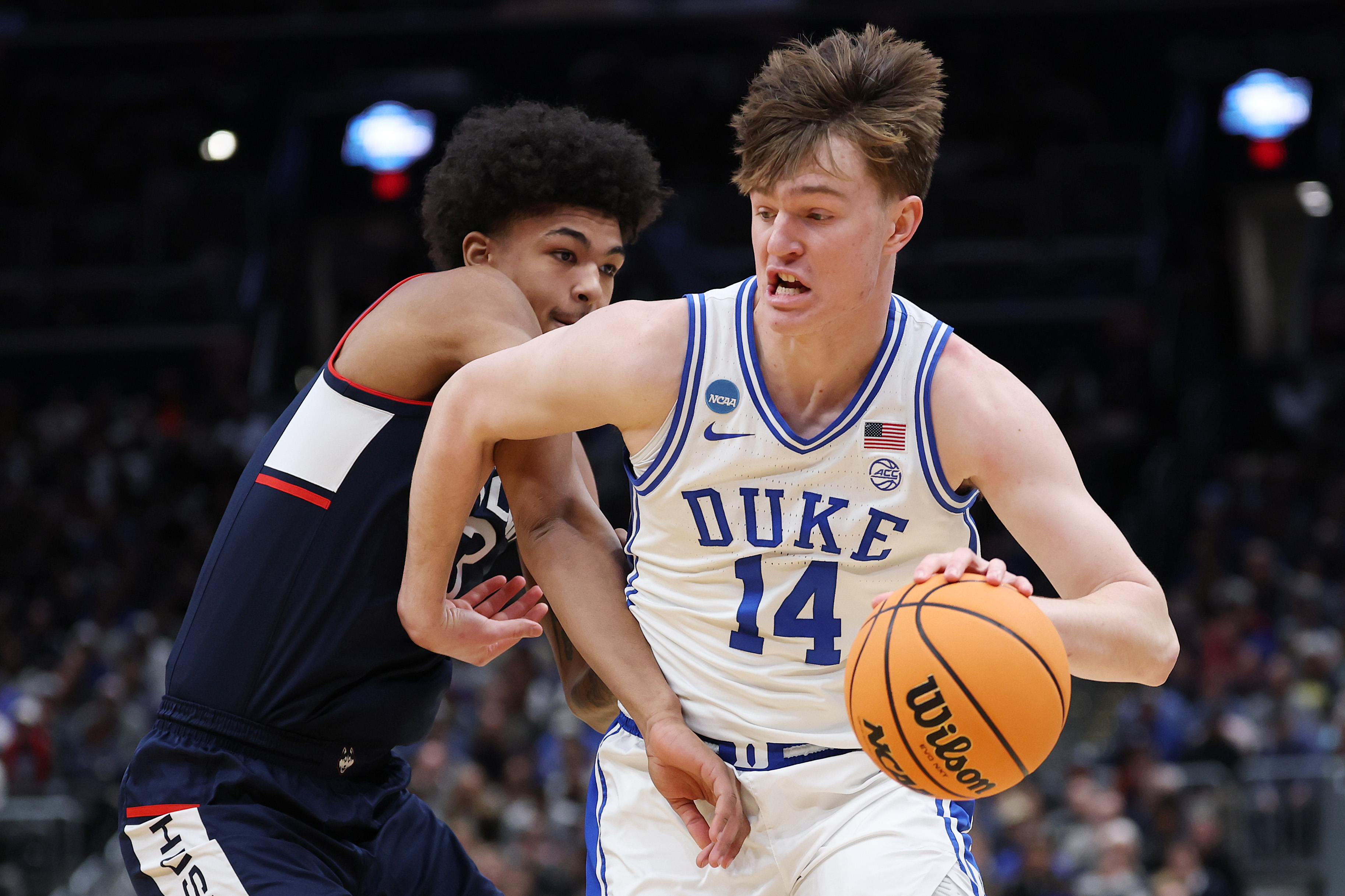 WASHINGTON, DC - MARCH 29: Nikolas Khamenia #14 of the Duke Blue Devils drives to the rim during the first half of a game against the UConn Huskies in the Elite Eight of the 2026 NCAA Men's Basketball Tournament at Capital One Arena on March 29, 2026 in Washington, DC.  (Photo by Patrick Smith/Getty Images)