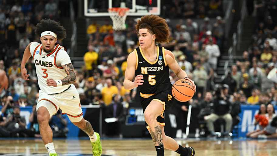 Mar 20, 2026; St. Louis, MO, USA; Missouri Tigers guard T.O. Barrett (5) drives to the basket against Miami (FL) Hurricanes d
