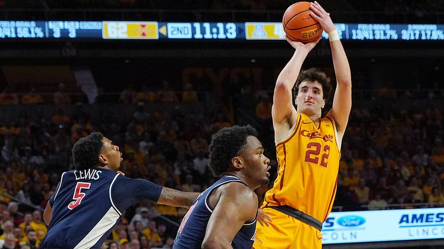 Iowa State Cyclones forward Milan Momcilovic (22) shoots the ball around Arizona Wildcats guard KJ Lewis.