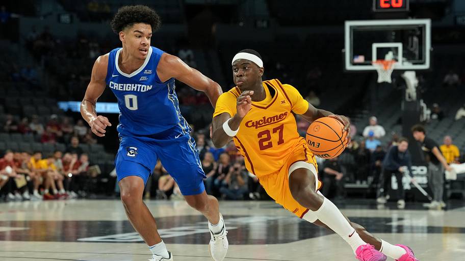 Iowa State Cyclones guard Killyan Toure (27) drives to the basket defended by Creighton Bluejays forward Jasen Green.