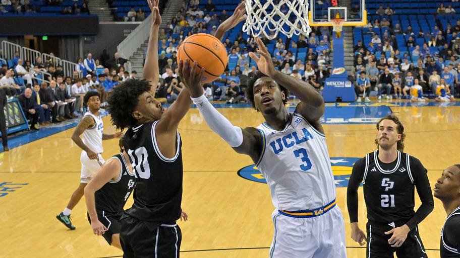 UCLA Bruins guard Eric Dailey Jr. (3) is defended by Cal Poly Mustangs guard Hamad Mousa.