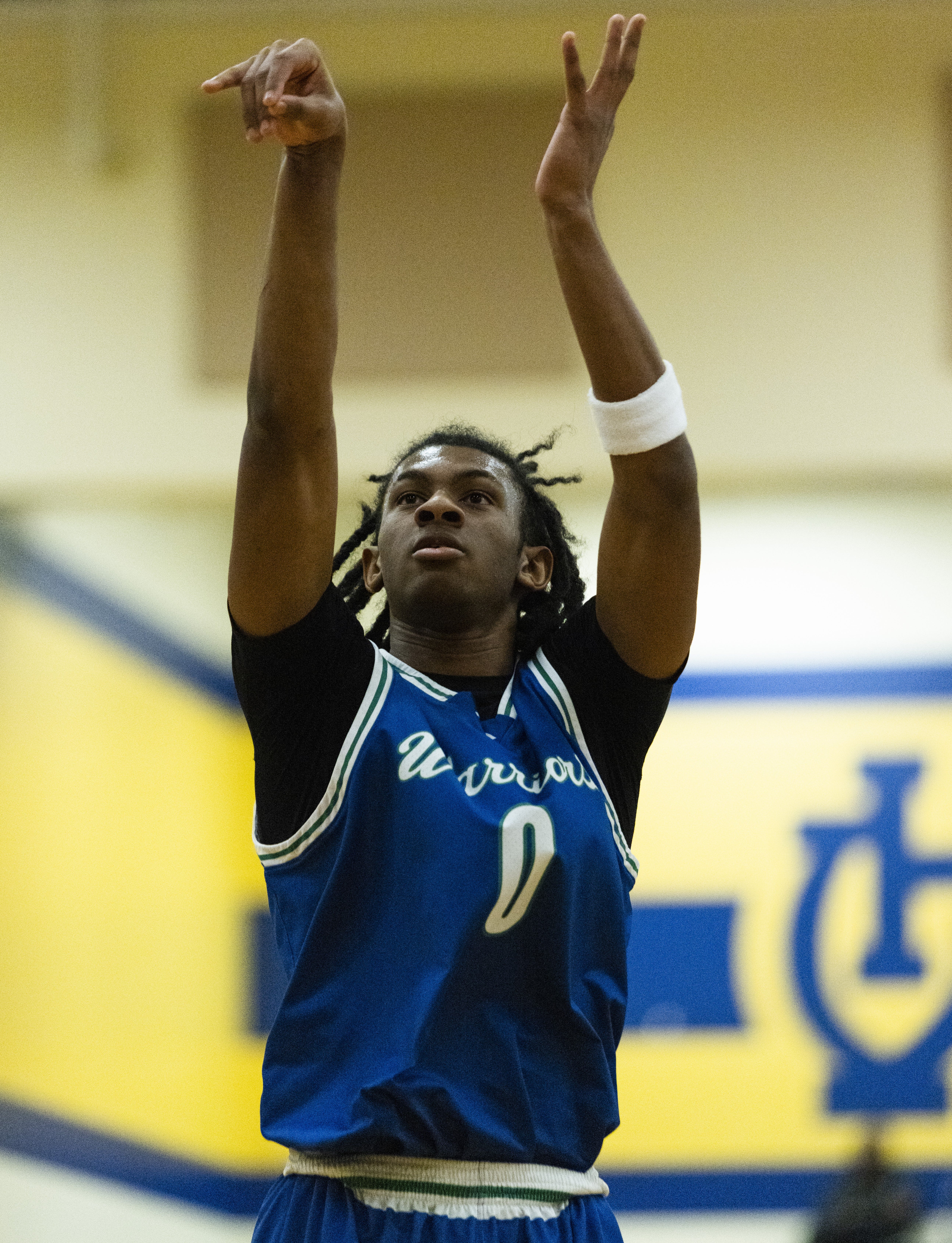 Isaiah Mack-Russell (0) of the Winton Woods Warriors shoots a free throw against Walnut Hills last Dec. 9. Mack-Russell, top scorer in the ECC has been offered by the Cincinnati Bearcats.