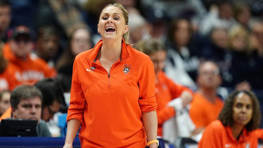 Oklahoma State Cowgirls head coach Jacie Hoyt coaches from the sideline.