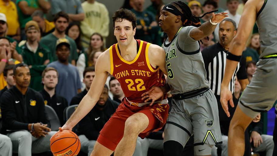 Iowa State Cyclones forward Milan Momcilovic (22) drives to the basket as Baylor Bears guard Obi Agbim defends.