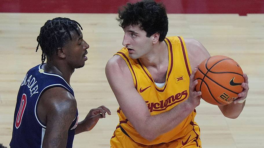 Iowa State Cyclones forward Milan Momcilovic (22) looks for drive around Arizona Wildcats guard Jaden Bradley.