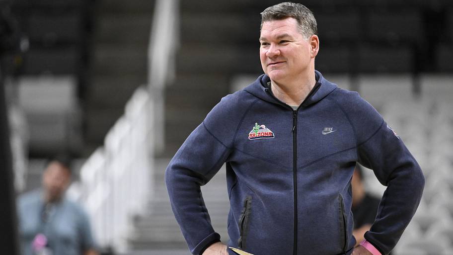 Arizona Wildcats head coach Tommy Lloyd smiles during a practice session.