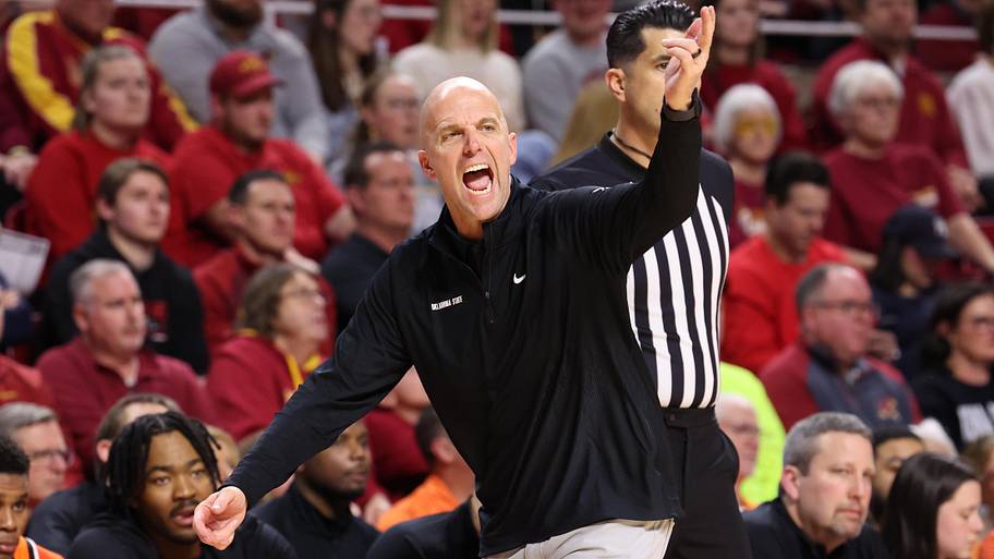 Oklahoma State Cowboys head basketball coach Steve Lutz coaches his team from the sideline.