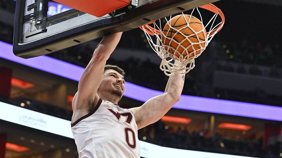 Mar 5, 2024; Louisville, Ky.; Virginia Tech guard Hunter Cattoor (0) dunks against Louisville.