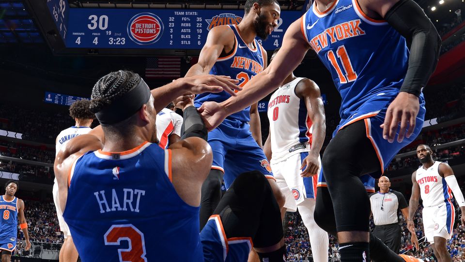 Mikal Bridges and Jalen Brunson help up Josh Hart during a game against the Detroit Pistons in the 2025 NBA Playoffs on April 27, 2025. - Chris Schwegler/NBAE/Getty Images
