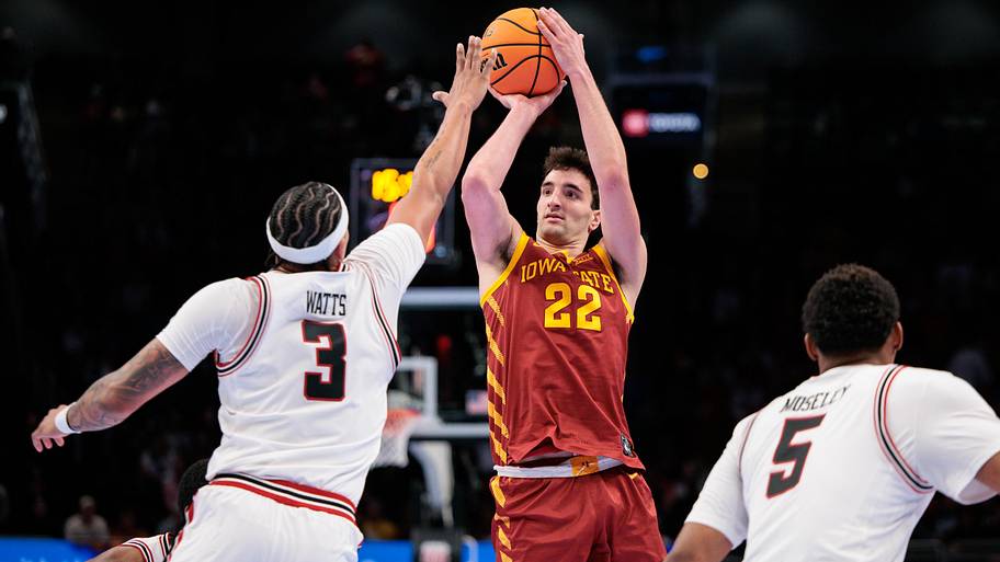 Iowa State Cyclones forward Milan Momcilovic (22) shoots the ball over Texas Tech Red Raiders forward LeJuan Watts.