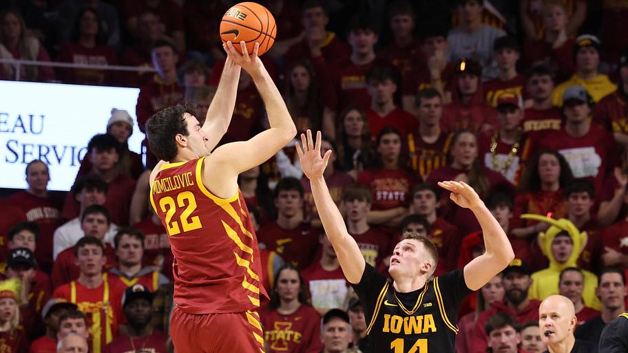 Iowa State Cyclones forward Milan Momcilovic (22) shoots over Iowa Hawkeyes guard Bennett Stirtz.