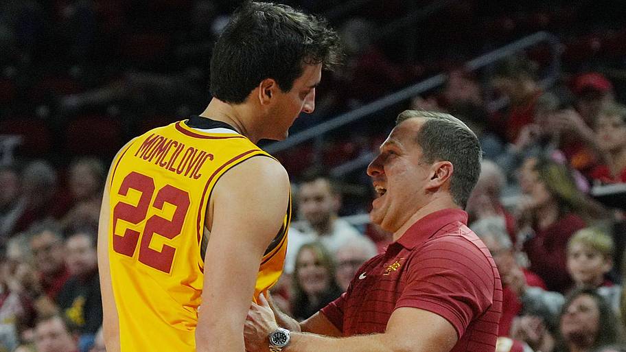 Iowa State Cyclones men's basketball head coach T.J. Otzelberger congratulates forward Milan Momcilovic.