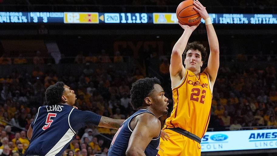 Iowa State Cyclones forward Milan Momcilovic (22) shoots the ball around Arizona Wildcats guard KJ Lewis.