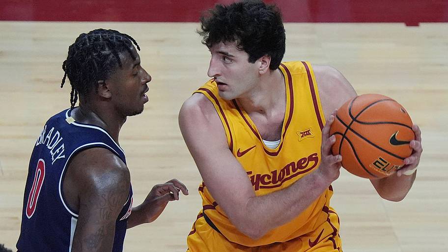 Iowa State Cyclones forward Milan Momcilovic (22) looks for drive around Arizona Wildcats guard Jaden Bradley.