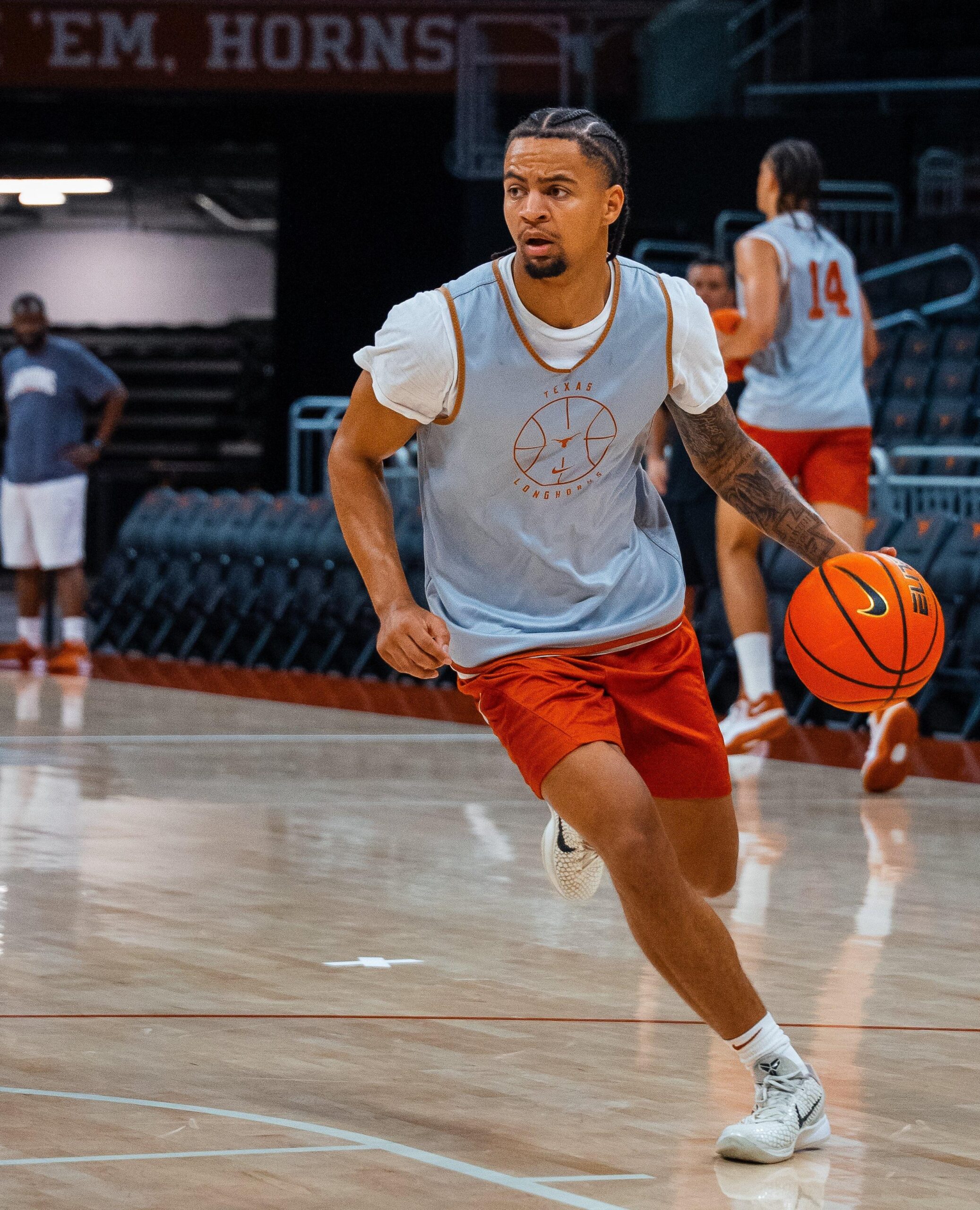 Texas G Mikey Lewis fractured his foot in practice