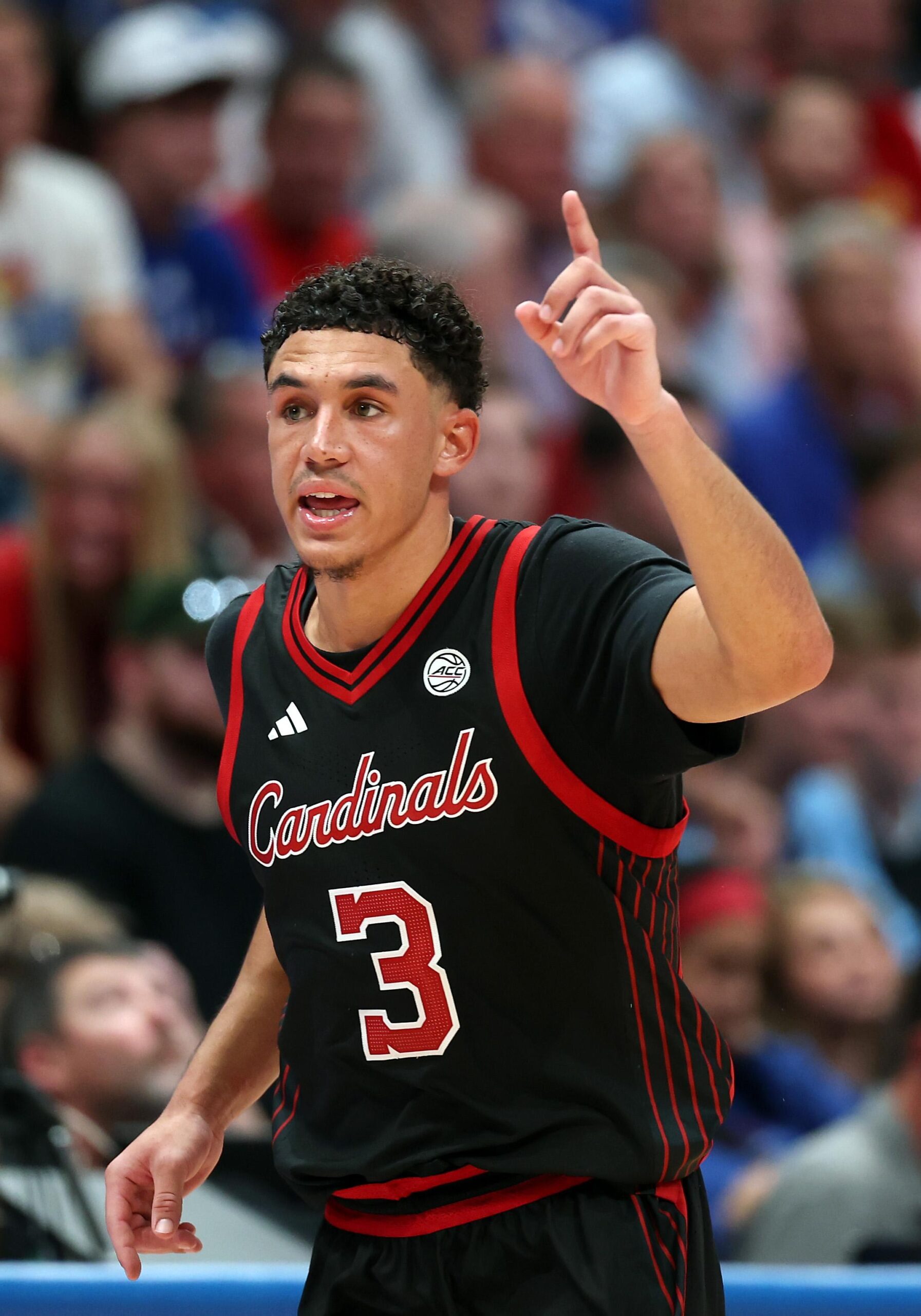 Louisville opens exhibition season with 89-83 win at Kansas